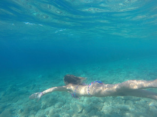 Young woman diving
