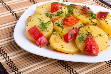 Closeup view on slices of potato on the wooden background