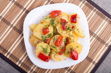 Top view of the pieces of potato stew with vegetables