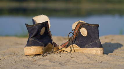  Sports gym shoes on a sand