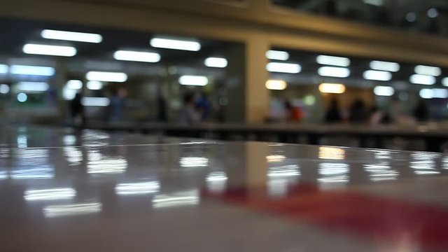 table and chair at food court blurred background