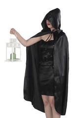 Halloween witch woman holding lantern
