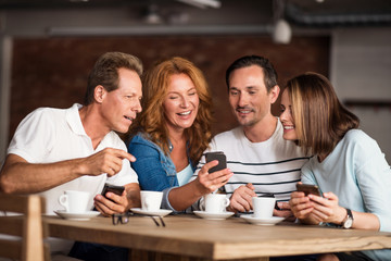 Nice men and women using phones