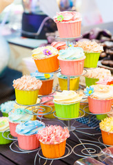 Fototapeta na wymiar Sweet colorful cupcake in group at shop