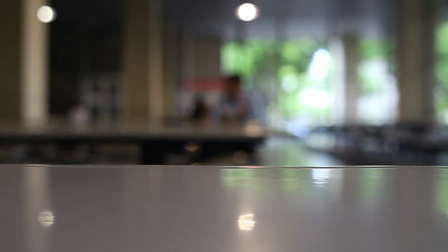 table and chair at food court blurred background