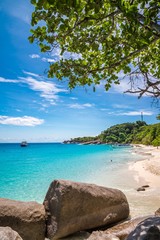 Fototapeta na wymiar Beautiful tropical Similan island in sunny day blue sky background - Travel summer beach holiday concept.