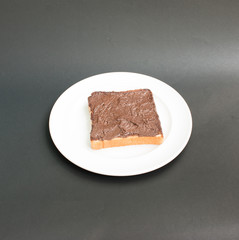 Chocolate  crunchy cream spread over bread