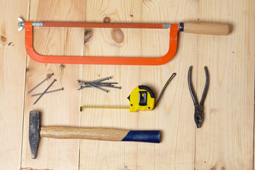 Set of tools over a wood background
