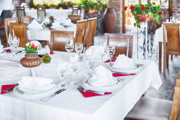 Glasses and plates on table in restaurant