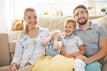 Fototapeta premium Family with Two Kids Laughing