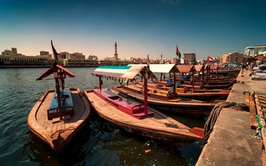 Foto auf Acrylglas Mittlerer Osten Traditional Abra taxi boats in Dubai creek - Deira during sunny day, Dubai Deira, United Arab Emirates