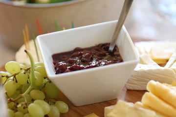 small square bowl with home made cherry preserves