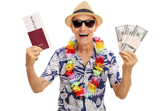 Elderly tourist holding stacks of money
