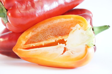 Beautiful red and yellow peppers isolated on white background