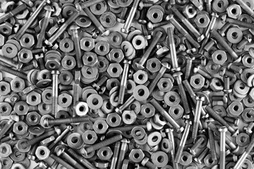 Black and white background of nuts and screws