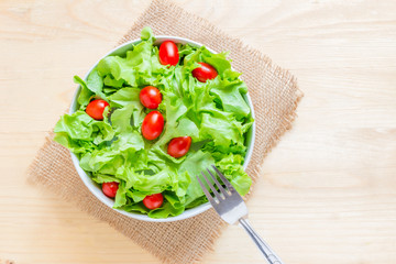 healthy food fresh vegetable salad and fork On a wooden table