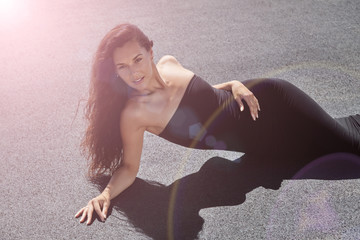 beauty woman with curly hair on the roof