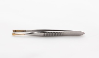 Tweezers on a white background