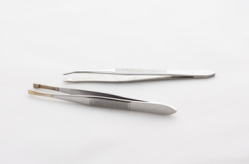 Two tweezers on a white background