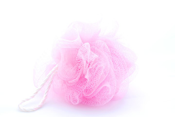 Pink sponge on a white background