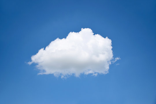single cloud on clear blue sky background
