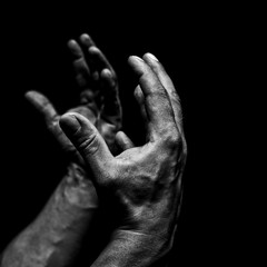 Men's hands on a black background
