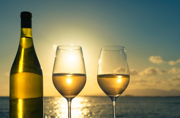 Pair of wine glasses in a beautiful vacation setting. 