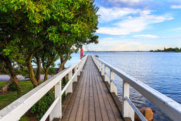 Sea pier landscape, old wooden pier and blue sky