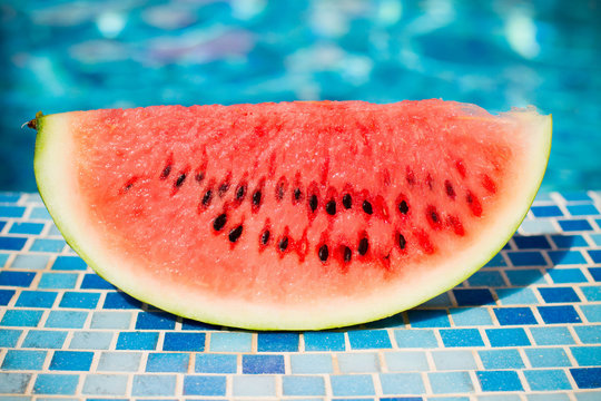slices of fresh juicy organic watermelon on a pool