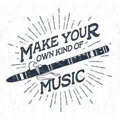 Hand drawn tribal label with textured flute vector illustration and "Make your own kind of music" inspirational lettering. © SlothAstronaut