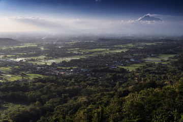 Fototapeta premium View of Jogjakarta with Merapi volcano, Jawa, Indonesia