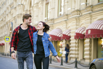 Beautiful young couple on a walk in the city