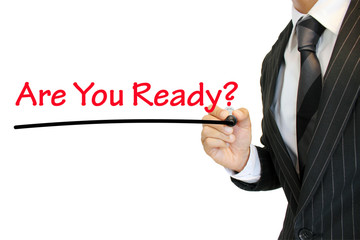 “Are you ready?” 準備万端か尋ねるビジネスマン a question written by a young...