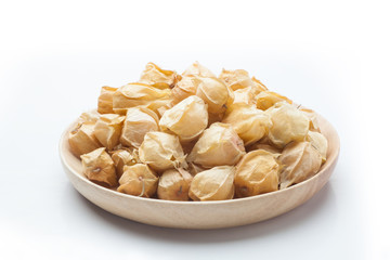 Physalis fruit in a wooden plate