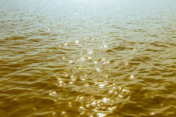 Gold and blue sea water with sunlight