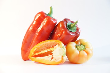 Beautiful red and yellow peppers, isolated on white background