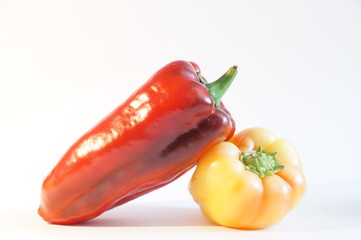 Beautiful red and yellow peppers, isolated on white background