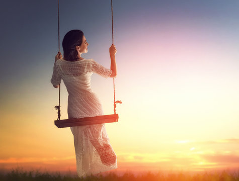 Young Woman On A Swing