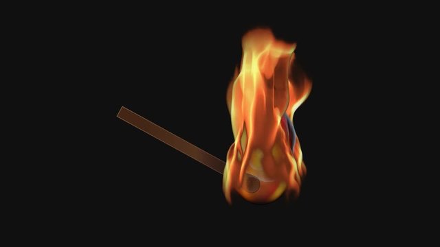 Match head lighting and burning in slow motion shot on black background