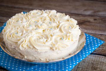 Home baked cake with cream roses
