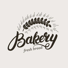 Bakery. Hand written lettering logo with ear of wheat. Typography badge, label, emblem. Template logotype. Vector illustration.