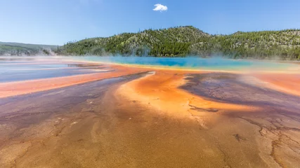 Gordijnen Beautiful Grand Prismatic Spring against blue sky in Midway Geyser Basin, Yellowstone National Park, Wyoming. Unusual colors of the lake. © khomlyak