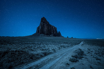 Night sky with many stars above Shiprock in New Mexico