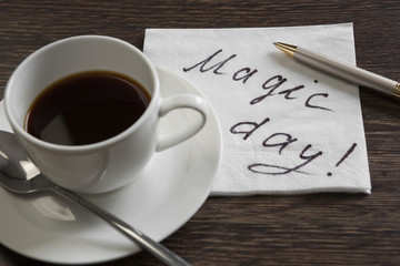 Coffee cup and napkin with message