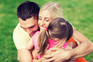 Fototapeta premium happy family hugging outdoors