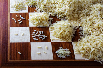 chessboard with expotential growing heaps of rice grains, concept unlimited growth