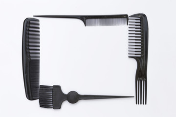 Black plastic hair stylish comb frame on white background