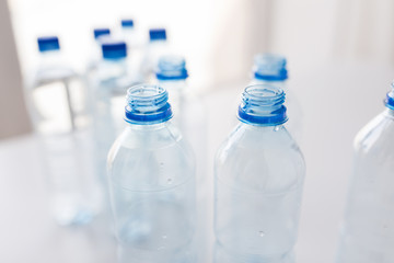 close up of bottles with drinking water on table