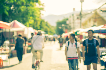 Blurred image of street market, split retro tone color effected