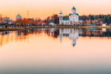Obraz premium View Of Alexander Nevsky Orthodox Church On Lake Shore, Sunset Sunrise
